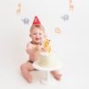 happy baby with cake at Huntingdon cake smash photography session