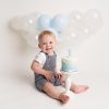 baby smiling with cake at Huntingdon cake smash photography session