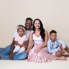 family sitting down posing in Huntingdon family photography studio session